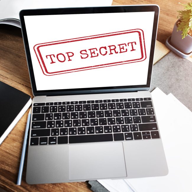 Laptop with Top Secret written on screen